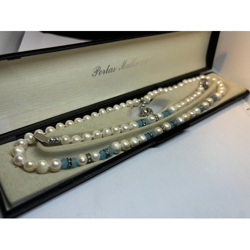 649 - A BOXED FRESHWATER PEARL SET TO INCLUDE A NECKLACE AND BRACELET