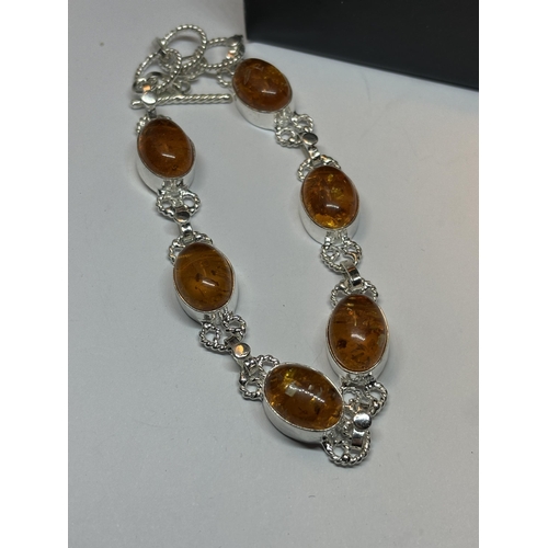 654 - A MARKED SILVER BRACELET WITH SIX AMBER STONES IN A PRESENTATION BOX