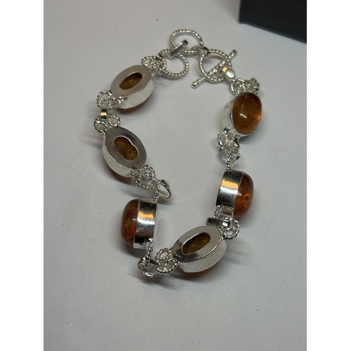 654 - A MARKED SILVER BRACELET WITH SIX AMBER STONES IN A PRESENTATION BOX