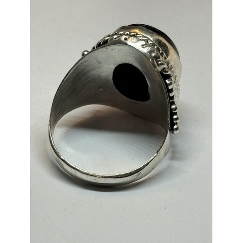 655 - A MARKED SILVER RING WITH LARGE ONYX STONE SIZE Q IN A PRESENTATION BOX