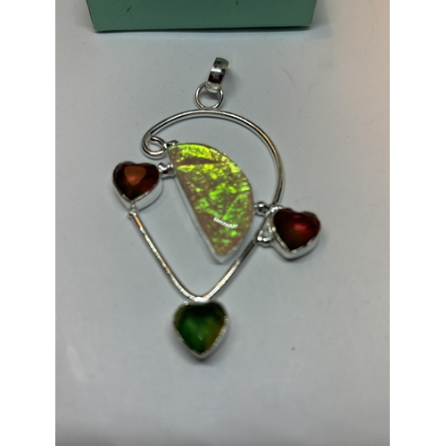 658 - A MARKED SILVER, OPAL, PERIDOT AND GARNET MULTI HEART PENDANT IN A PRESENTATION BOX