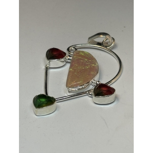 658 - A MARKED SILVER, OPAL, PERIDOT AND GARNET MULTI HEART PENDANT IN A PRESENTATION BOX