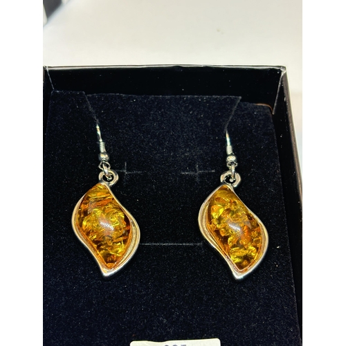 659 - A PAIR OF MARKED SILVER AND PRESSED AMBER DROP EARRINGS IN A PRESENTATION BOX