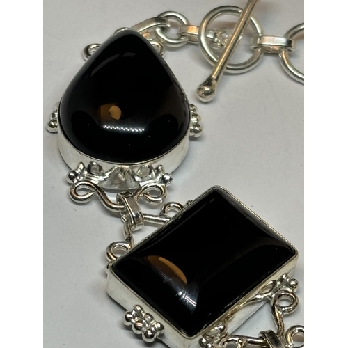 664 - A MARKED SILVER BRACELET WITH FIVE LARGE BLACK ONYX STONES IN A PRESENTATION BOX