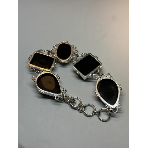 664 - A MARKED SILVER BRACELET WITH FIVE LARGE BLACK ONYX STONES IN A PRESENTATION BOX