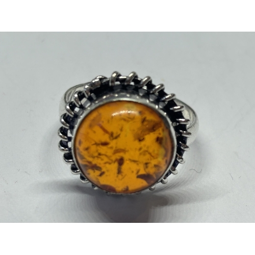 665 - A MARKED SILVER RING WITH CIRCULAR AMBER STONE SIZE N IN A PRESENTATION BOX