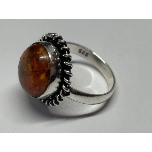 665 - A MARKED SILVER RING WITH CIRCULAR AMBER STONE SIZE N IN A PRESENTATION BOX