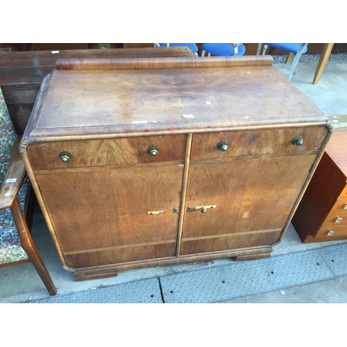 2601 - AN ART DECO WALNUT SIDEBOARD WITH RAISED BACK, TWO DRAWERS AND TWO CUPBOARDS, 46