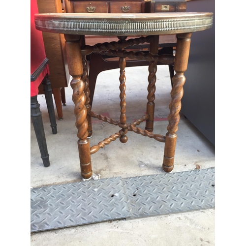 2604 - AN ANGLO INDIAN TABLE WITH EMBOSSED BRASS TOP, 23.5