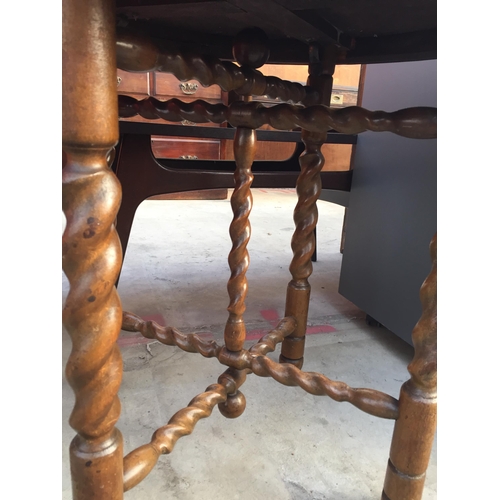 2604 - AN ANGLO INDIAN TABLE WITH EMBOSSED BRASS TOP, 23.5