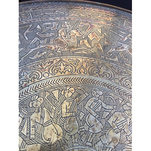 2604 - AN ANGLO INDIAN TABLE WITH EMBOSSED BRASS TOP, 23.5