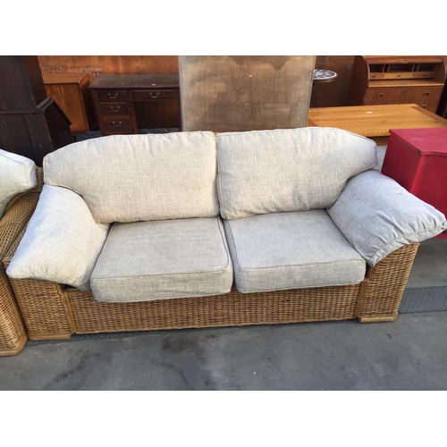 2606 - A WICKER THREE SEATER SETTEE AND MATCHING TWO SEATER SETTEE