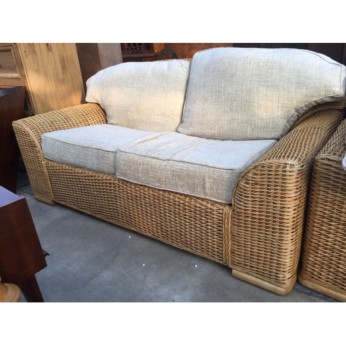 2606 - A WICKER THREE SEATER SETTEE AND MATCHING TWO SEATER SETTEE