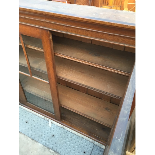 2610 - A LATE VICTORIAN OAK TWO DOOR BOOKCASE TOP, 46