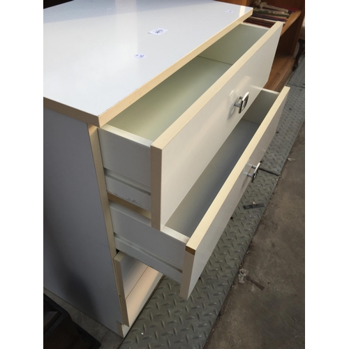 2613 - A WHITE CHEST OF FOUR DRAWERS, 24