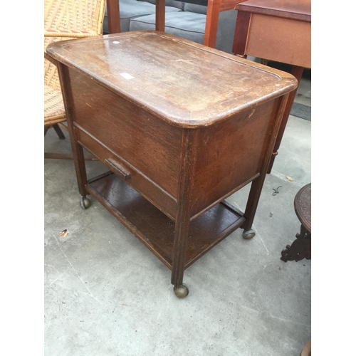 2678 - A MID 20TH CENTURY OAK SEWING BOX/TABLE ON CASTERS