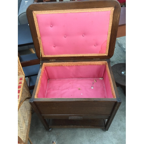 2678 - A MID 20TH CENTURY OAK SEWING BOX/TABLE ON CASTERS