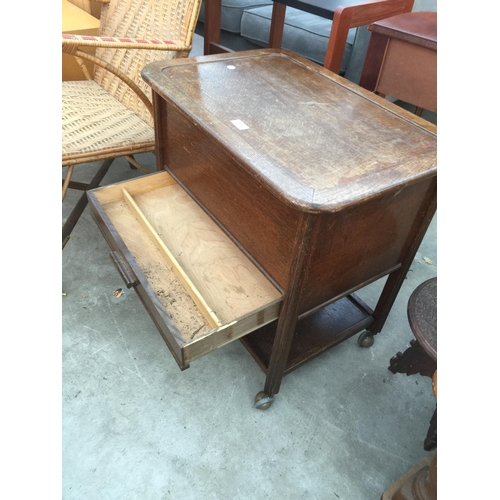 2678 - A MID 20TH CENTURY OAK SEWING BOX/TABLE ON CASTERS