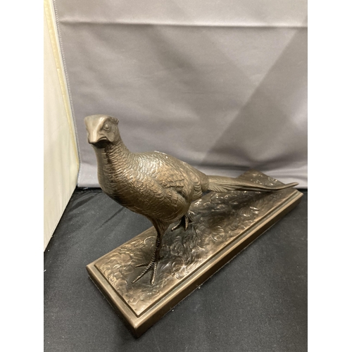 17 - A BRONZE EFFECT PHEASANT FIGURE ON A PLINTH