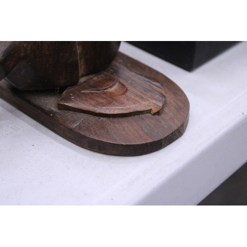 225 - A WOODEN COAT RACK WITH ELEPHANTS HEADS FOR THE HANGERS