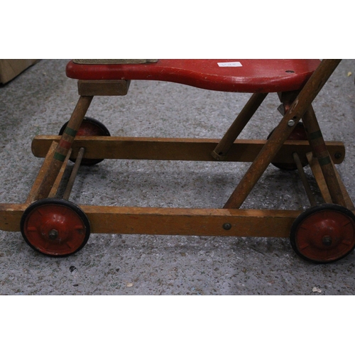 234 - A VINTAGE TRI-ANG WOODEN HORSE WITH WHEELS AND A HANDLE