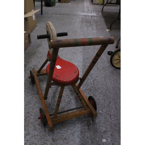 234 - A VINTAGE TRI-ANG WOODEN HORSE WITH WHEELS AND A HANDLE