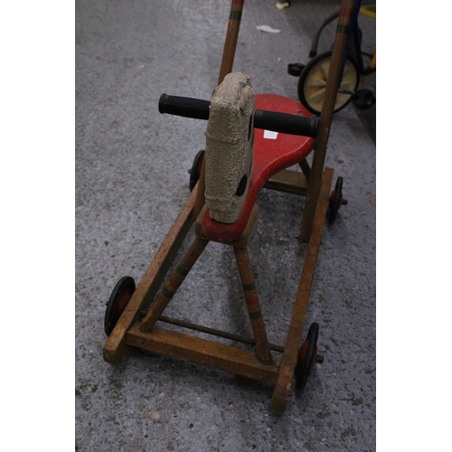 234 - A VINTAGE TRI-ANG WOODEN HORSE WITH WHEELS AND A HANDLE