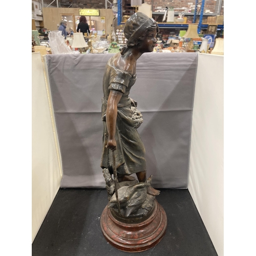 24 - A BRONZE EFFECT SCULPTURE OF A LADY WITH GEESE ON A WOODEN BASE