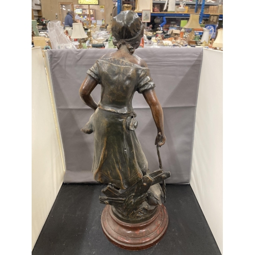 24 - A BRONZE EFFECT SCULPTURE OF A LADY WITH GEESE ON A WOODEN BASE