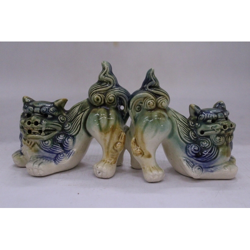 251 - A PAIR OF ORIENTAL FOO DOGS