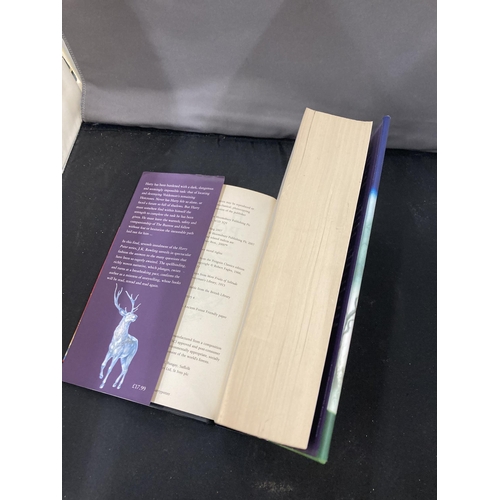 28 - A FIRST EDITION HARRY POTTER AND THE DEATHLY HALLOWS HARDBACK BOOK WITH DUST COVER IN GOOD CONDITION