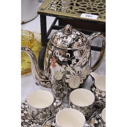 286 - A VINTAGE GRAYS POTTERY COFFEE SET IN A SILVER GILT FLORAL PATTERN TO INCLUDE, A COFFEE POT, A CREAM... 