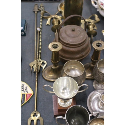 300 - A QUANTITY OF BRASSWARE, ETC TO INCLUDE A PAIR OF WALL SCONCES, A LARGE TRENCH ART VASE, CANDLEABRA,... 