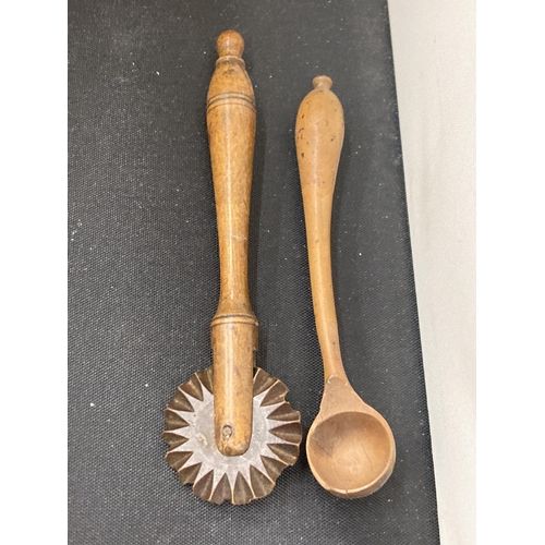 33 - A RUSTIC 19TH CENTURY SALT AND SPICE BOX WITH SPICE SPPON AND PASTRY WHEEL