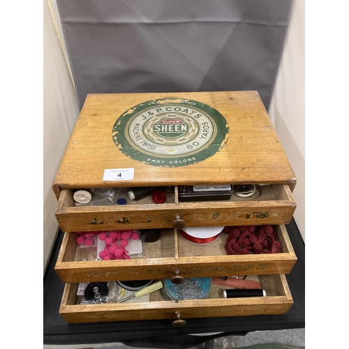 4 - A VINTAGE THREE DRAWER SEWING CABINET WITH ADVERTISING LABELS AND CONTENTS