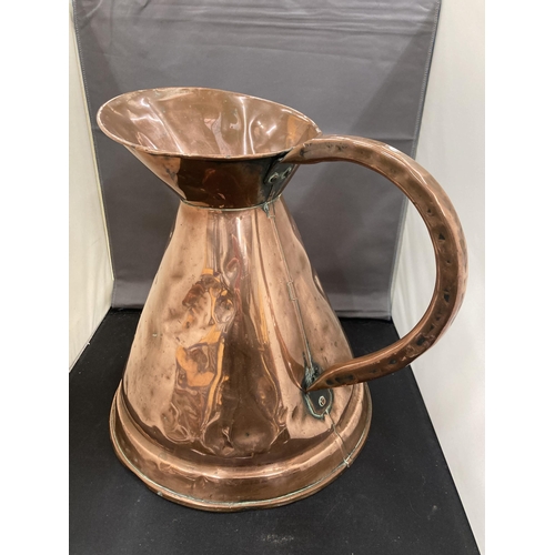 40 - A LARGE COPPER JUG WITH A BRASS PLAQUE ROYAL GEORGE