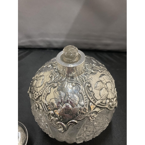 6 - A CUT GLASS PERFUME BOTTLE WITH A DECORATIVE  HALLMARKED BIRMINGHAM SILVER SHOULDERS AND TOP COMPLET... 