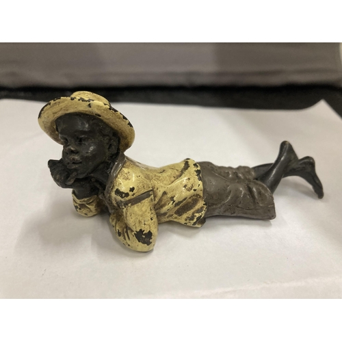 74 - A COLD PAINTED BRONZE OF A BOY LYING DOWN, APPROX LENGTH 9CM