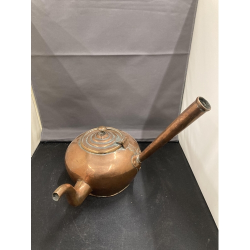 77 - TWO COPPER KETTLES TO INCLUDE AN UNUSUAL ROUND TAPERING DESIGN WITH A HANDLE ATTACHED TO THE MAIN BO... 