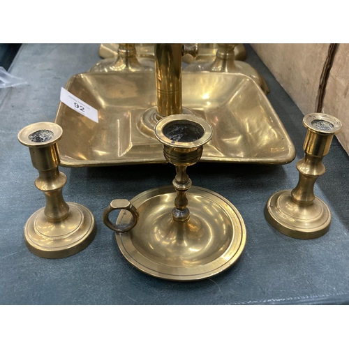 92 - EIGHT CIRCA 18TH CENTURY BRASS CANDLESTICKS TO INCLUDE THREE PAIRS AND TWO CHAMBER STICKS