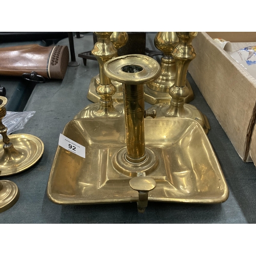 92 - EIGHT CIRCA 18TH CENTURY BRASS CANDLESTICKS TO INCLUDE THREE PAIRS AND TWO CHAMBER STICKS