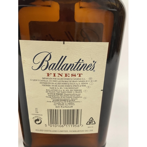 498 - A LITRE BOTTLE OF BALLANTINE'S FINEST SCOTCH WHISKY TOGETHER WITH A 70CL BOTTLE OF MARTELL V S FINE ... 