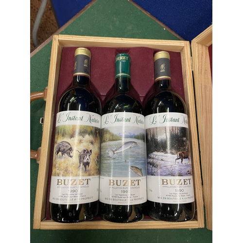 555 - A WOODEN CASE CONTAINING THREE BOTTLES L INSTANT NATURE GRAND VIN DE BUZET