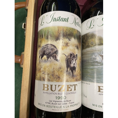 555 - A WOODEN CASE CONTAINING THREE BOTTLES L INSTANT NATURE GRAND VIN DE BUZET