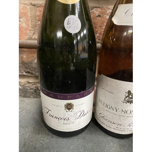 558 - A BOTTLE OF FRANCOIS DUBOIS CHAMPAGNE AND A PULIGNY MONTRACHETCHANSON 1984