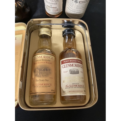 575 - THREE MINATURE WHISKIES TO INCLUDE A TIN WITH TWO GLENMORANGIE, THE BALVENIE SINGLE MALT AND A BESWI... 