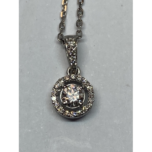 614 - AN 18 CARAT WHITE GOLD HALLMARKED PENDANT WITH CHAIN SET WITH A ROUND BRILLIANT CUT NATURAL DIAMOND ... 