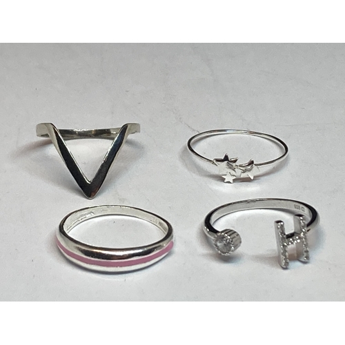 694 - FOUR MARKED SILVER RINGS TO INCLUDE AN H INITIAL