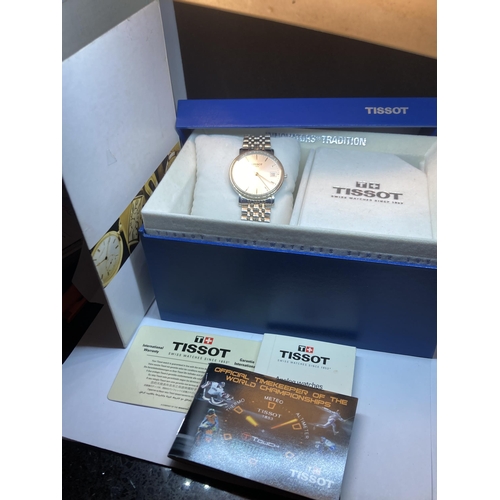 717 - A TISSOT WRISTWATCH WITH PAPERS IN ORIGINAL PRESNTATION BOX AND SLEEVE