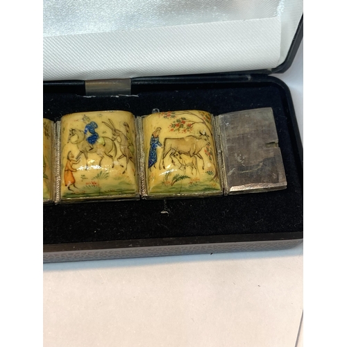 727 - A PAINTED PANEL STORY BRACELET IN A PRESENTATION BOX